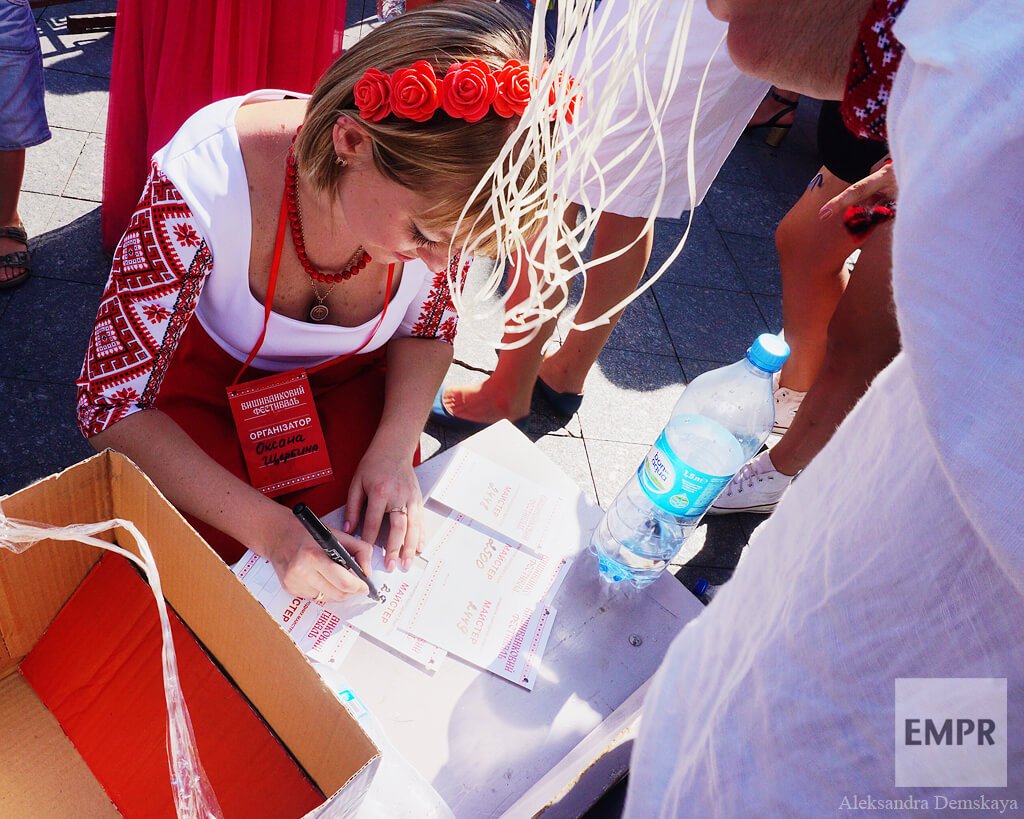 The organisers of the flash mob hastily fill in eaxtra tags with numbers